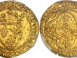 a gold coin with a crown on the front and a shield on the back