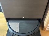 an image of a black and gray toilet in a room