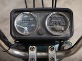 a close up of a motorcycle with a speedometer and gauges