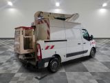 a white van with a ladder on the back of it