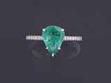 a pear shaped emerald and diamond ring