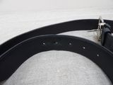 a black leather belt with a silver buckle on it