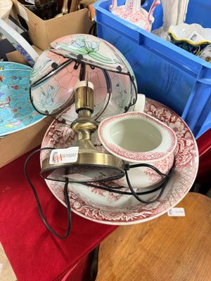 many plates and cups sitting on a red table