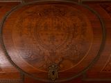 a wooden wall with a decorative design on it