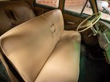 an old car with a leather seat in the back