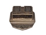 an image of a metal box with a lid that has a design on it