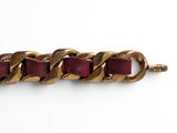 gold and burgundy leather bracelet with a chain link