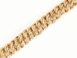 a close up of a gold chain on a white background