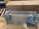 a metal cage with a pair of shoes inside of it