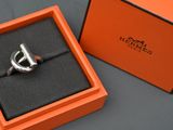 an orange box with a ring inside of it on a table