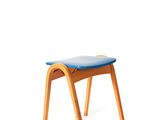 a small wooden stool with a blue seat on a white background