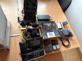 a table with a lot of electronics on top of it