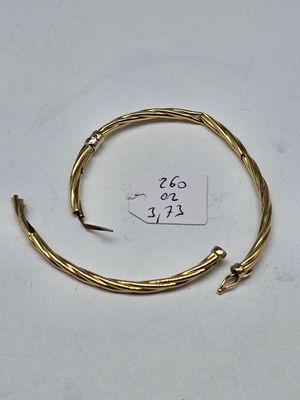 a close up of a piece of gold wire with a price tag on it