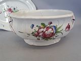 a white bowl with a floral design on it