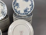 several blue and white plates are stacked on top of each other