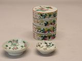 three small bowls and a small bowl sitting next to each other
