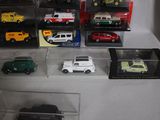 a lot of toy cars that are in a display case