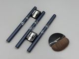 three brushes and a brush sitting on a table