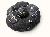 a picture of a black and white brooch with a blue and white pattern