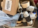 a cardboard box filled with assorted items on the floor