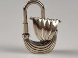 a small silver object with a hook on it