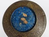 a picture of a picture of a blue and gold plate