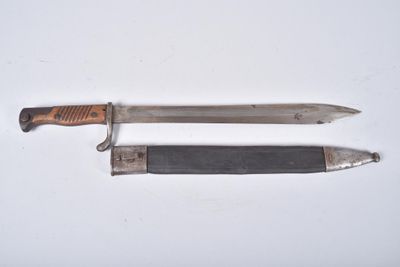 a knife and a knife holder on a white surface