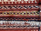 a close up of a red rug with a pattern on it