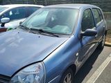 a blue car parked in a parking lot next to other cars
