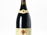 a bottle of wine that is sitting on a table