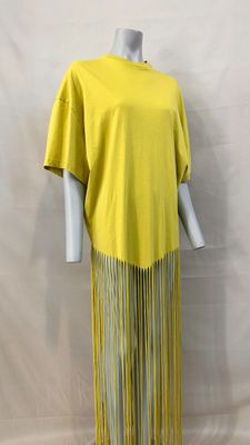 a woman ' s yellow dress with fringes on a mannequin mannequin mannequin mann