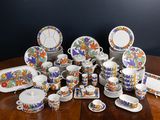 many different types of dishes and cups on the table