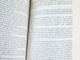 a person holding an open book in their hand