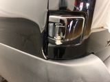 a close up of a car door handle with a mirror on it