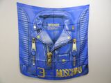 a picture of a blue moschino jacket hanging on a wall