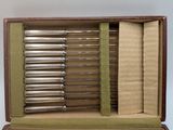 a box that has a bunch of silverware inside of it