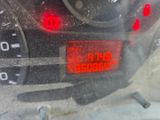 a close up of a car ' s dashboard with a speedometer