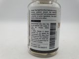 a close up of a bottle of pills on a table