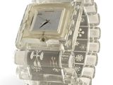 a clear watch with a square face on a clear bracelet