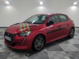 a picture of a red car that is parked on a checkered floor
