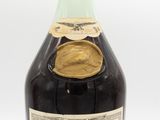 an image of a bottle of wine sitting on top of a table