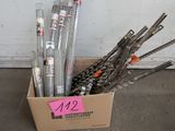 a cardboard box with a bunch of scissors in it