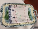 a ceramic tray with a blue and white design on it