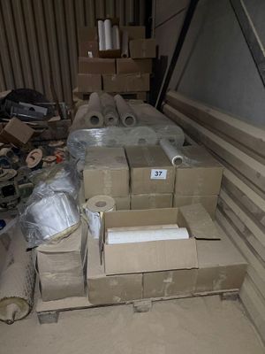 a pile of boxes sitting on the floor in a room