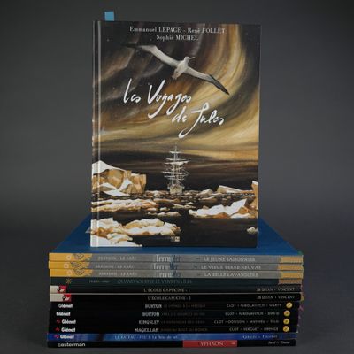 books stacked on top of each other on a black surface