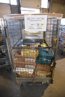 a large metal cage with a sign on top of it