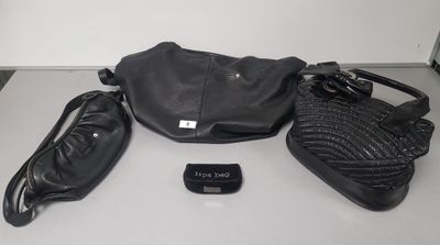 a black purse and a cell phone sitting on a table