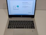 the laptop is open on the table with the screen on