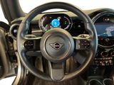 the interior of a car with a steering wheel and dashboard