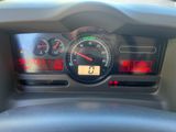 a close up of a car dashboard with a speedometer